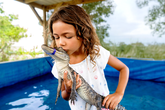 girl with baby gator
